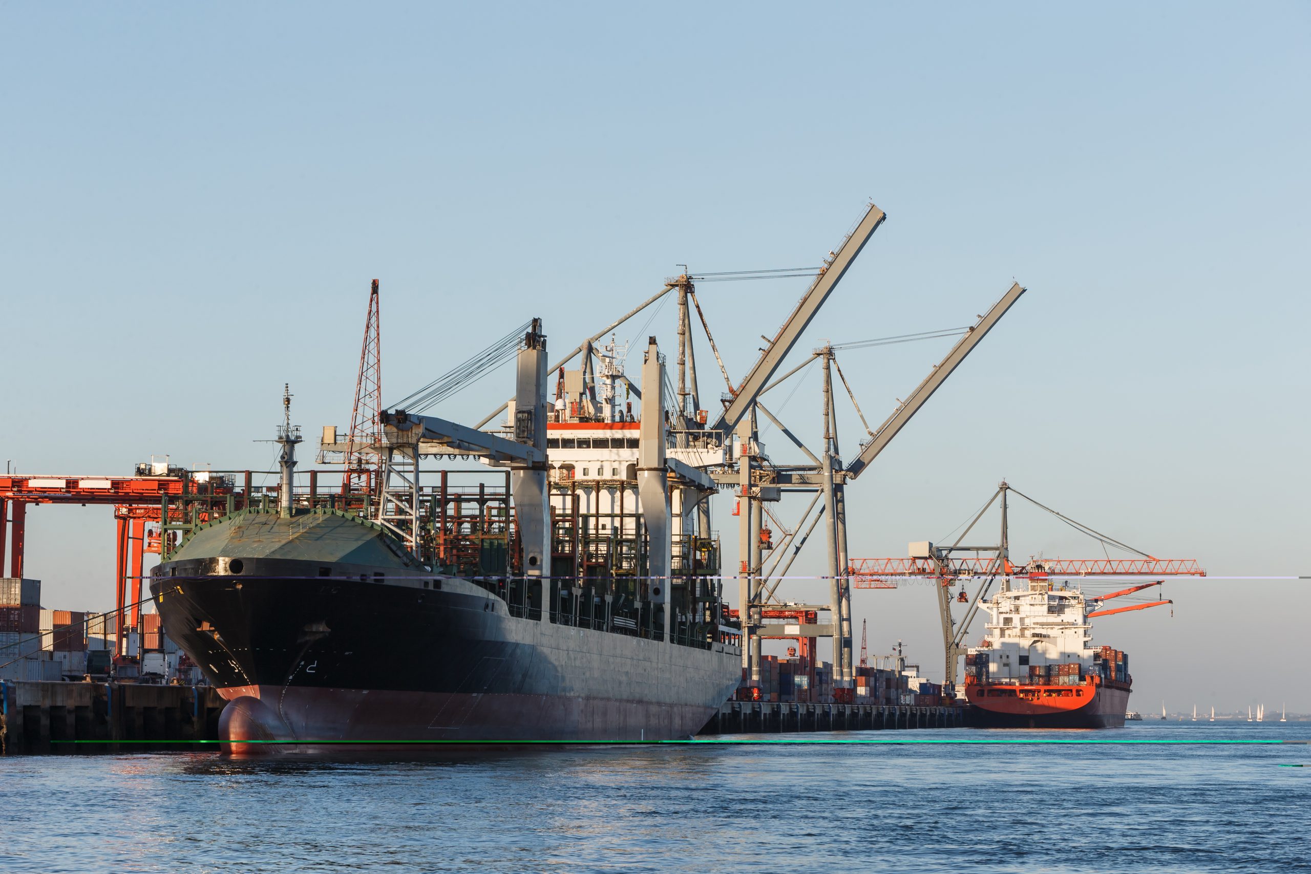 Cargo ships in port being loaded